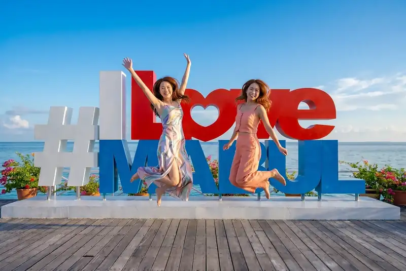 Iconic photo spot at the I Love Mabul sign on Mabul Island Noura Resort